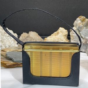 SOLD! Vintage Volupte USA Compact with Mirror and Black Case